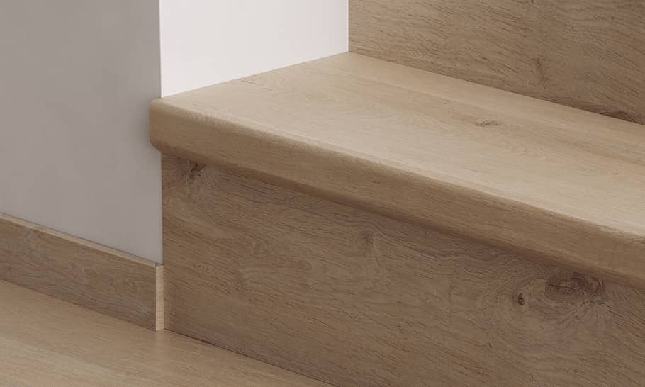 close up of stairs with beige laminate stair covers